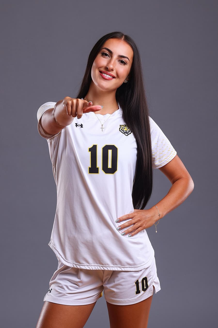 Arianna Rushenas smiling in her Dalhousie Tigers kit, pointing to the camera