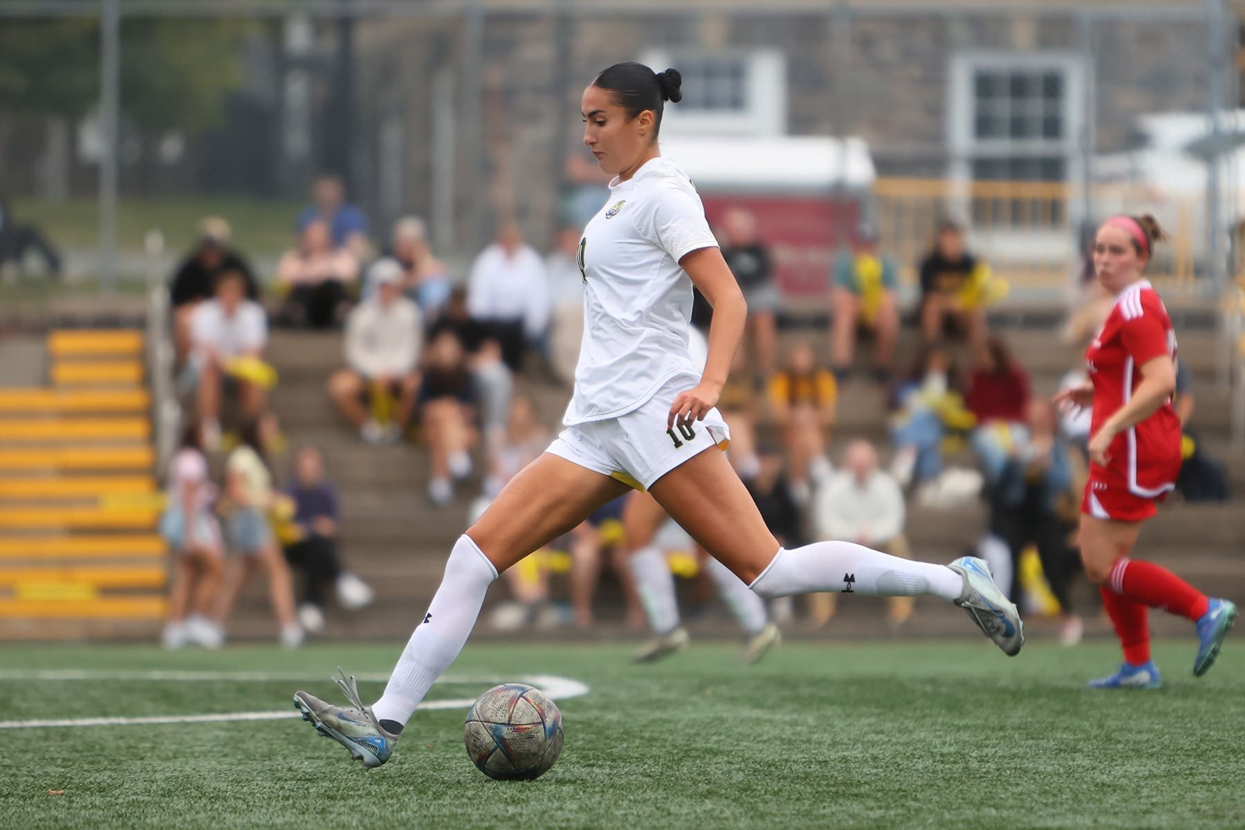 Arianna Rushenas striking the ball in her Dalhousie Tigers kit